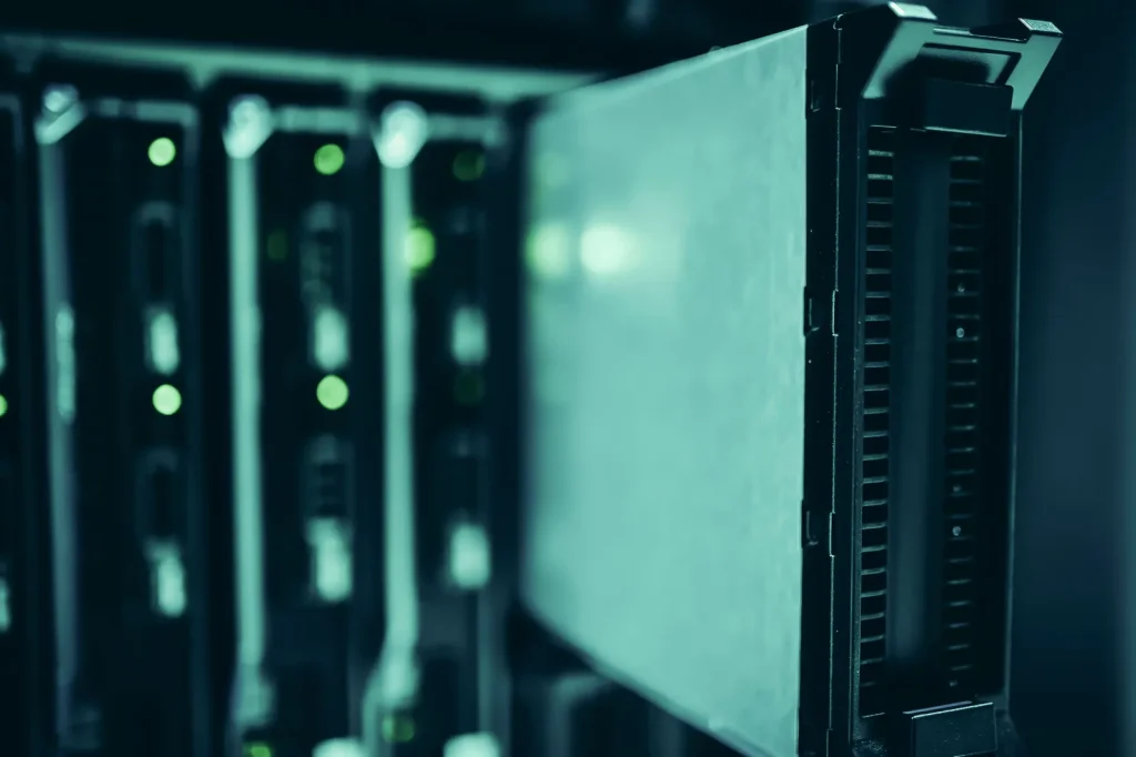 Close-up of a server rack with small green status lights